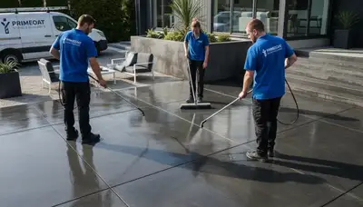 Concrete staining contractors applying decorative finish to patio in Boulder, CO