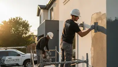 Professional stucco repair on Boulder CO home exterior by expert house painters restoring curb appeal